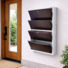 Wall-mounted 4-door grey metal shoe rack with white frame installed near wooden entrance door – space-saving premium Jootarack shoe storage cabinet
