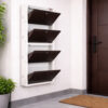 Wall-mounted 4-door grey metal shoe rack with white frame installed near wooden entrance door – space-saving premium Jootarack shoe storage cabinet
