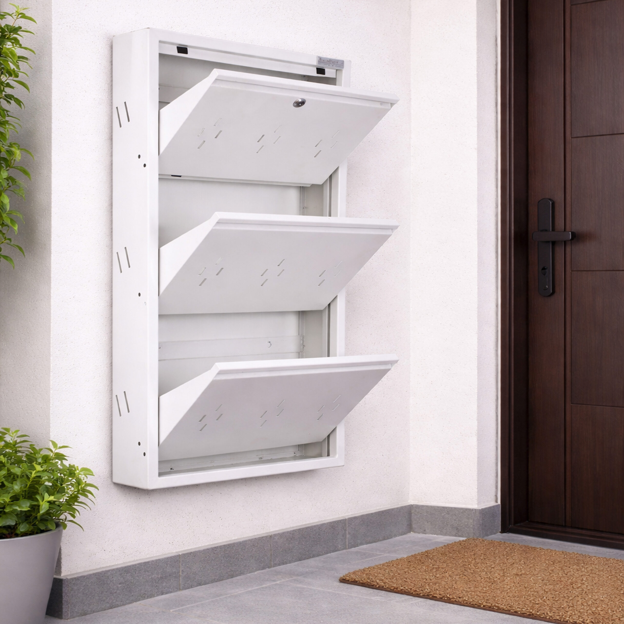 Wall-mounted 4-door grey metal shoe rack with white frame installed near wooden entrance door – space-saving premium Jootarack shoe storage cabinet